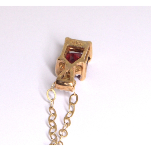 218 - 9ct gold garnet and Diamond pendant necklace on a 9ct gold chain of 40cm