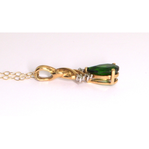 258 - 9ct gold Diamond and pear cut Diopside pendant necklace on a 9ct gold chain of 38cm