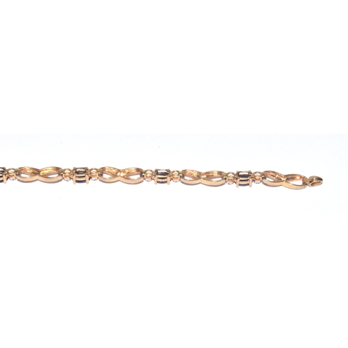 138 - 9ct gold Diamond and Sapphire line bracelet of 17cm long hall marked as diamond