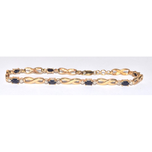 138 - 9ct gold Diamond and Sapphire line bracelet of 17cm long hall marked as diamond