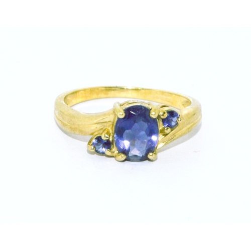 288 - 9ct gold ladies Amethyst ring with an oblong centre stone flanked by similar smaller stones size N