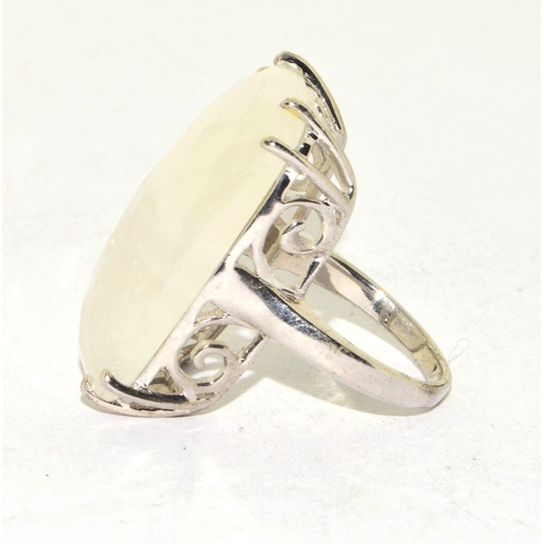 208 - 925 silver ladies large set rough clear crystal oblong single stone ring in an open scroll setting s... 