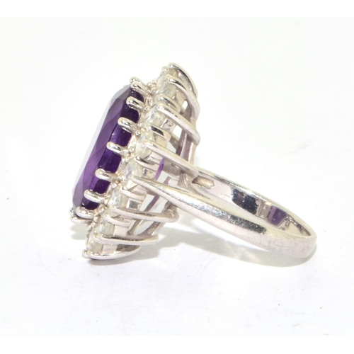 46 - 925 silver ladies large Amethyst halo design statement ring held in an open work claw setting size P