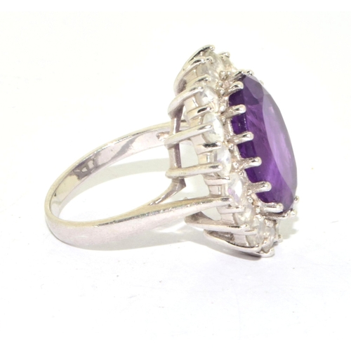 46 - 925 silver ladies large Amethyst halo design statement ring held in an open work claw setting size P