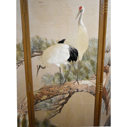 57 - A Japanese embroidered folding screen.Early-mid 20th century.carved wooden frame, with embroidered w... 