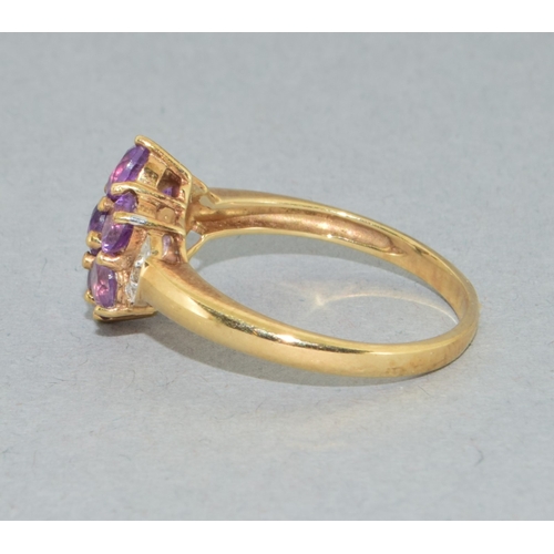 38 - 9ct gold ladies Amethyst flower head ring with accent Diamond decoration held in a claw setting size... 