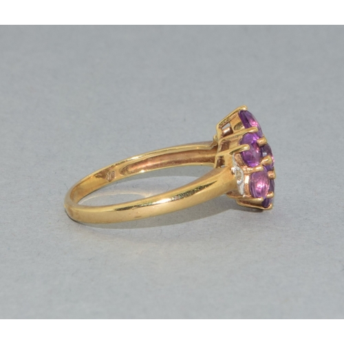 38 - 9ct gold ladies Amethyst flower head ring with accent Diamond decoration held in a claw setting size... 