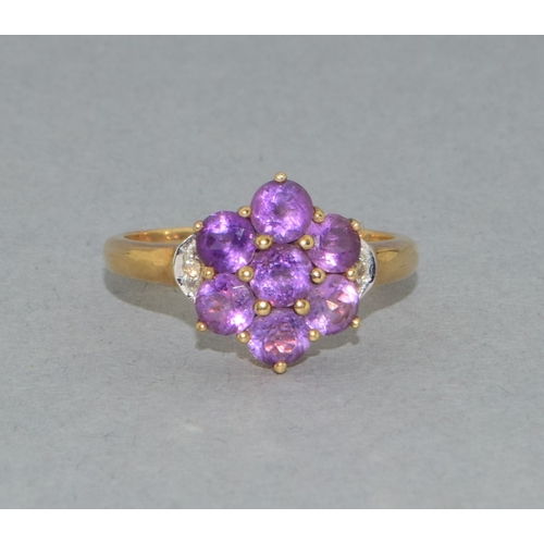 38 - 9ct gold ladies Amethyst flower head ring with accent Diamond decoration held in a claw setting size... 