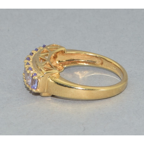 183 - 9ct gold ladies 7 stone Tanzanite large set bar ring set in an open work design 4grams size N