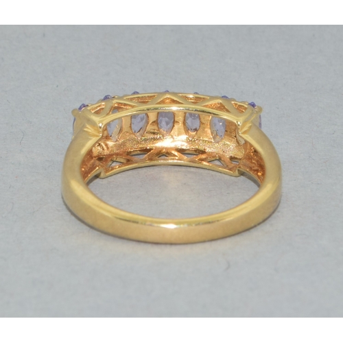 183 - 9ct gold ladies 7 stone Tanzanite large set bar ring set in an open work design 4grams size N