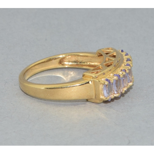 183 - 9ct gold ladies 7 stone Tanzanite large set bar ring set in an open work design 4grams size N