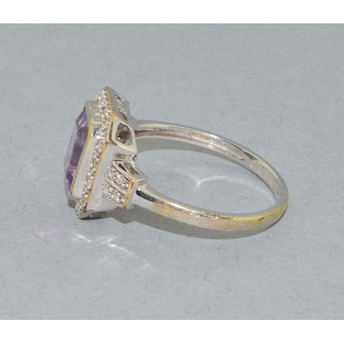 43 - 9ct white gold ladies Amethyst and Diamond halo design ring hall marked as 0.10ct Diamond in the rin... 