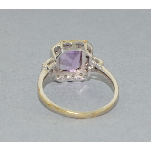 43 - 9ct white gold ladies Amethyst and Diamond halo design ring hall marked as 0.10ct Diamond in the rin... 