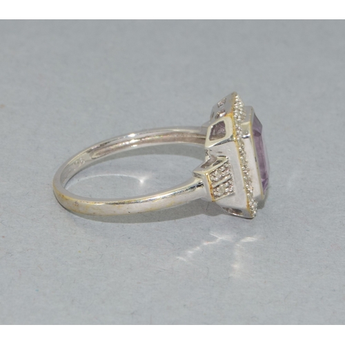 43 - 9ct white gold ladies Amethyst and Diamond halo design ring hall marked as 0.10ct Diamond in the rin... 
