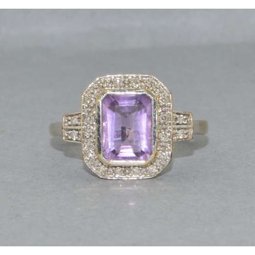 43 - 9ct white gold ladies Amethyst and Diamond halo design ring hall marked as 0.10ct Diamond in the rin... 