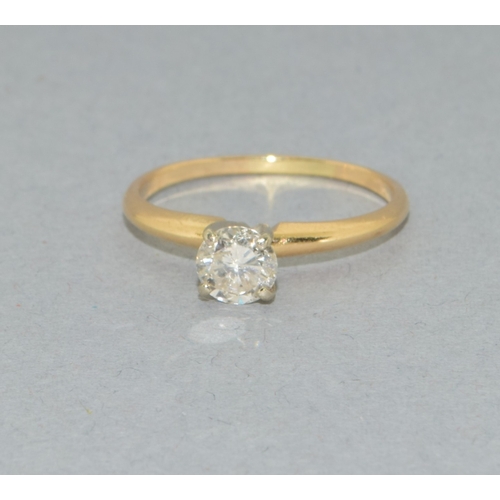 13 - 14ct gold ladies Diamond solitaire ring held in a claw setting stone approx 0.50ct size N