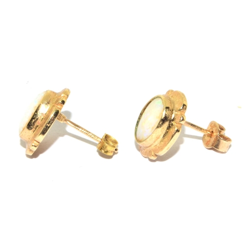 57 - 9ct gold Opal framed stud earrings 2.1grm