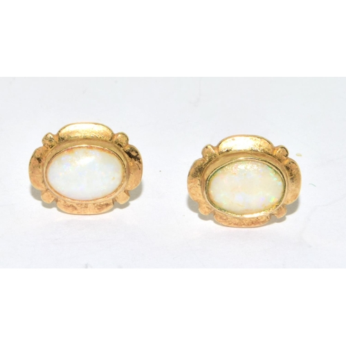 57 - 9ct gold Opal framed stud earrings 2.1grm
