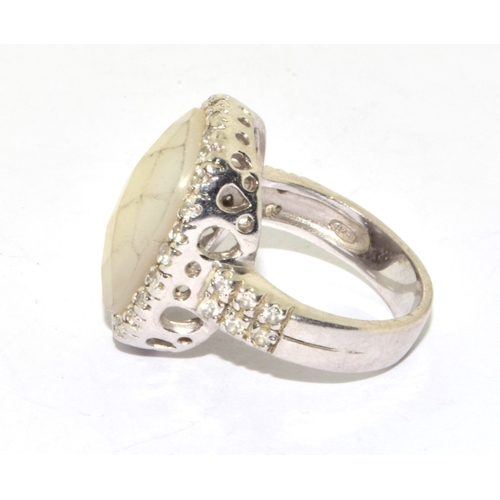 28 - 925 silver ladies facetted milky Chrystal halo design ring size M