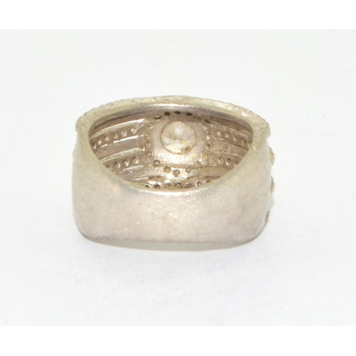48 - 925 silver 3 x row ring with a clear centre stone  size N