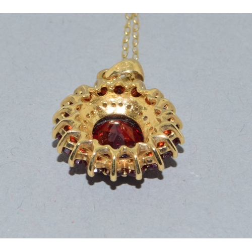 39 - 9ct gold Garnet and Diamond pendant necklace on a 9ct gold chain of 40cm long
