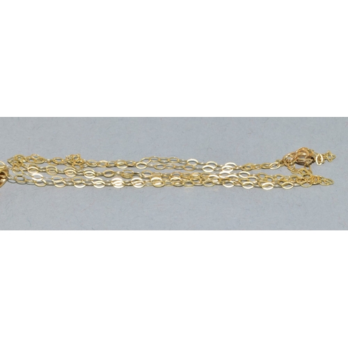 39 - 9ct gold Garnet and Diamond pendant necklace on a 9ct gold chain of 40cm long