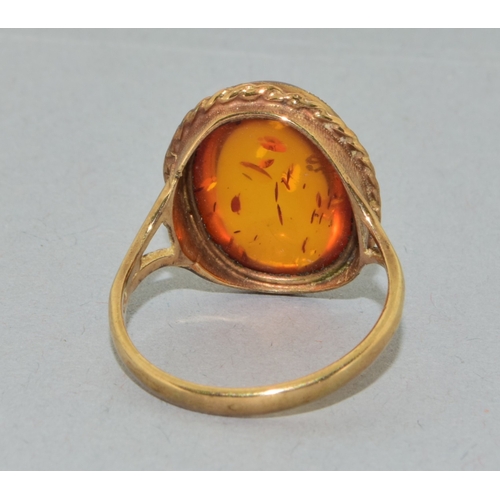 238 - 9ct gold ladies large size vintage  Amber dress ring held in an enclosed design size Q
