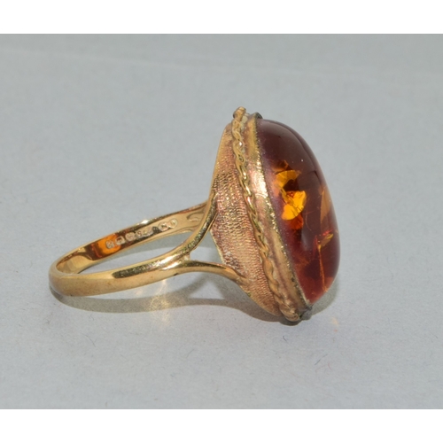 238 - 9ct gold ladies large size vintage  Amber dress ring held in an enclosed design size Q
