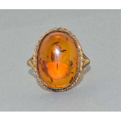 238 - 9ct gold ladies large size vintage  Amber dress ring held in an enclosed design size Q