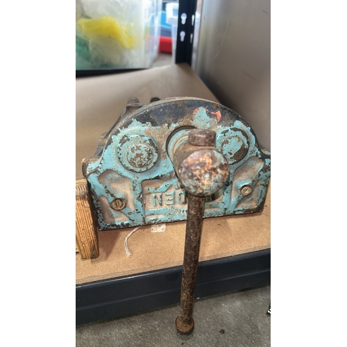 986 - Two vintage cast iron bench vices with handles and industrial design, featuring visible casting mark... 