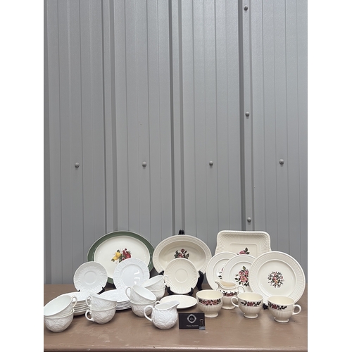 1005 - Vintage porcelain wash basin set featuring floral motifs and gilt accents, including pitcher and var... 