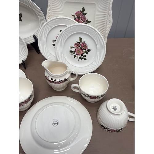 1005 - Vintage porcelain wash basin set featuring floral motifs and gilt accents, including pitcher and var... 