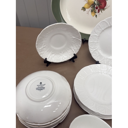 1005 - Vintage porcelain wash basin set featuring floral motifs and gilt accents, including pitcher and var... 