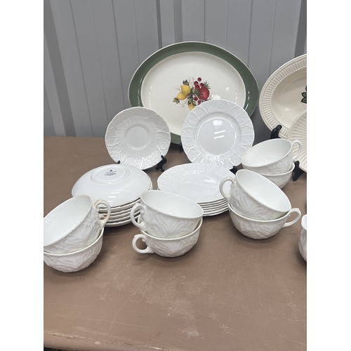 1005 - Vintage porcelain wash basin set featuring floral motifs and gilt accents, including pitcher and var... 