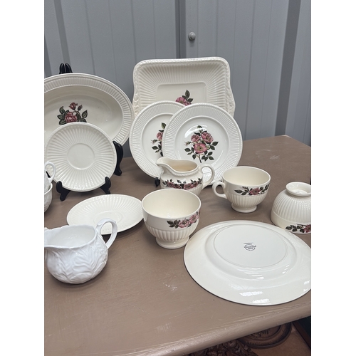 1005 - Vintage porcelain wash basin set featuring floral motifs and gilt accents, including pitcher and var... 