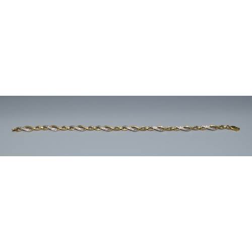 17 - 9ct gold and diamond Celtic style lobster claw bracelet with diamond insert. 7 inches long 5.7g