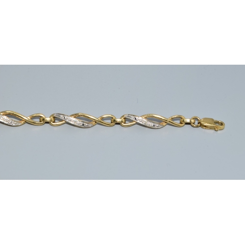 17 - 9ct gold and diamond Celtic style lobster claw bracelet with diamond insert. 7 inches long 5.7g
