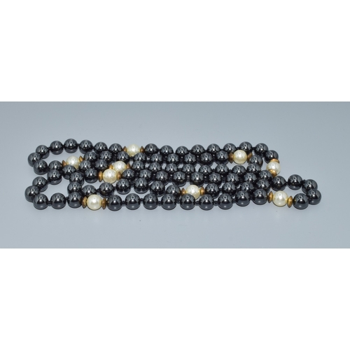 15 - Long strand of haematite and white pearl necklace all individually knotted 80cm long