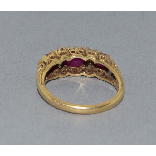 21 - Lovely 9ct gold vintage ladies Ruby and Diamond boat ring set in an open work scroll design size P 3... 