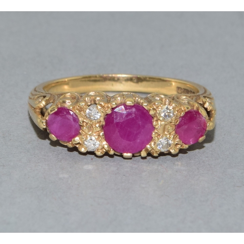 21 - Lovely 9ct gold vintage ladies Ruby and Diamond boat ring set in an open work scroll design size P 3... 