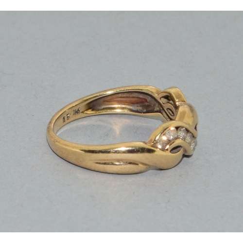 65 - 9ct gold ladies twit design Diamond ring hall marked as 0.25ct in the ring size N. 3.3grams