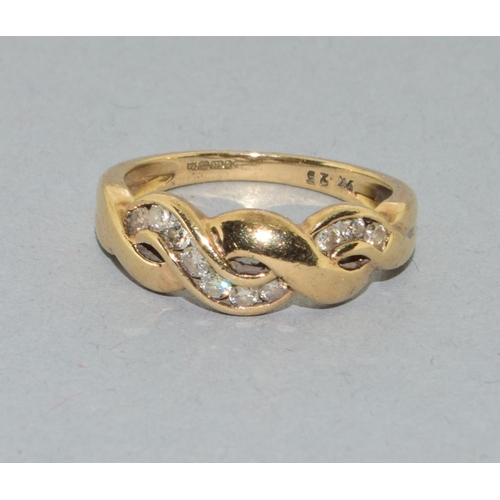 65 - 9ct gold ladies twit design Diamond ring hall marked as 0.25ct in the ring size N. 3.3grams