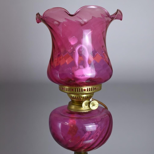 11 - A Cranberry glass Oil lamp.Converted to electric.Height - 49cm