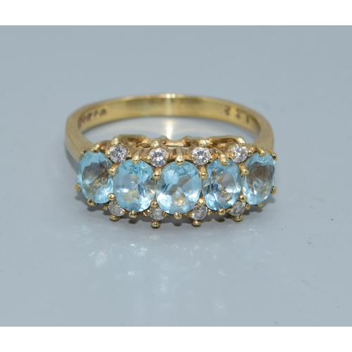 31 - 9ct gold vintage ladies 5 stone Aquamarine and clear accent gem stone ring in an open work setting s... 