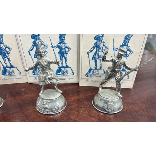 64 - Group boxed Buckingham Pewter hand-crafted solid pewter military figurines, each depicting a British... 