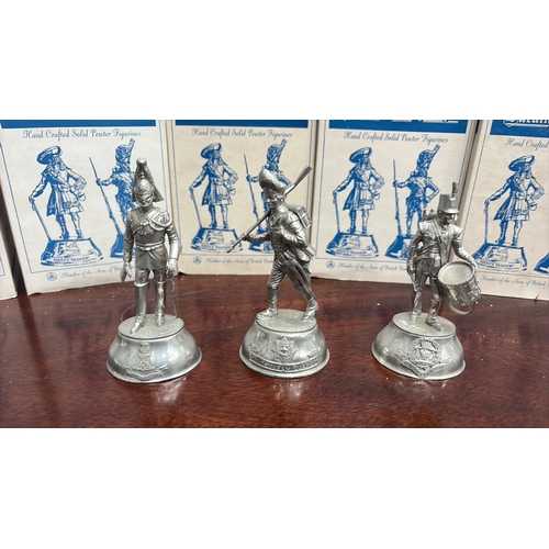 64 - Group boxed Buckingham Pewter hand-crafted solid pewter military figurines, each depicting a British... 