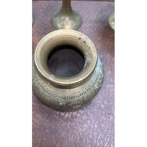 62 - Group of six Indian engraved brass wares: three stemmed goblets, a squat pot and two circular dishes... 