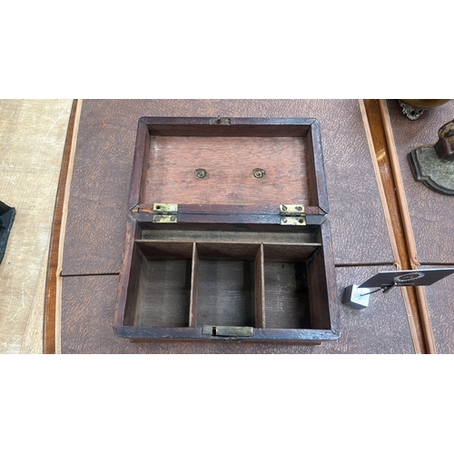 12 - Rectangular mahogany single-lid tea caddy with brass swing carrying handle, pierced escutcheon and b... 