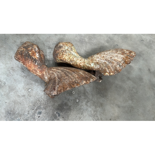11 - Pair of late 19th-century cast-iron claw-and-shell bathtub feet, moulded with radiating scallop shel... 