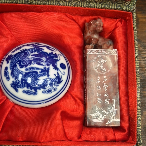 52 - Three Asian decorative pieces: stoneware laughing Buddha figurine; cloisonné enamel round trinket bo... 
